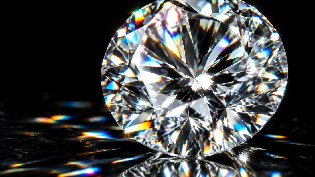 Brilliant cut diamond close-up with rainbow light refraction